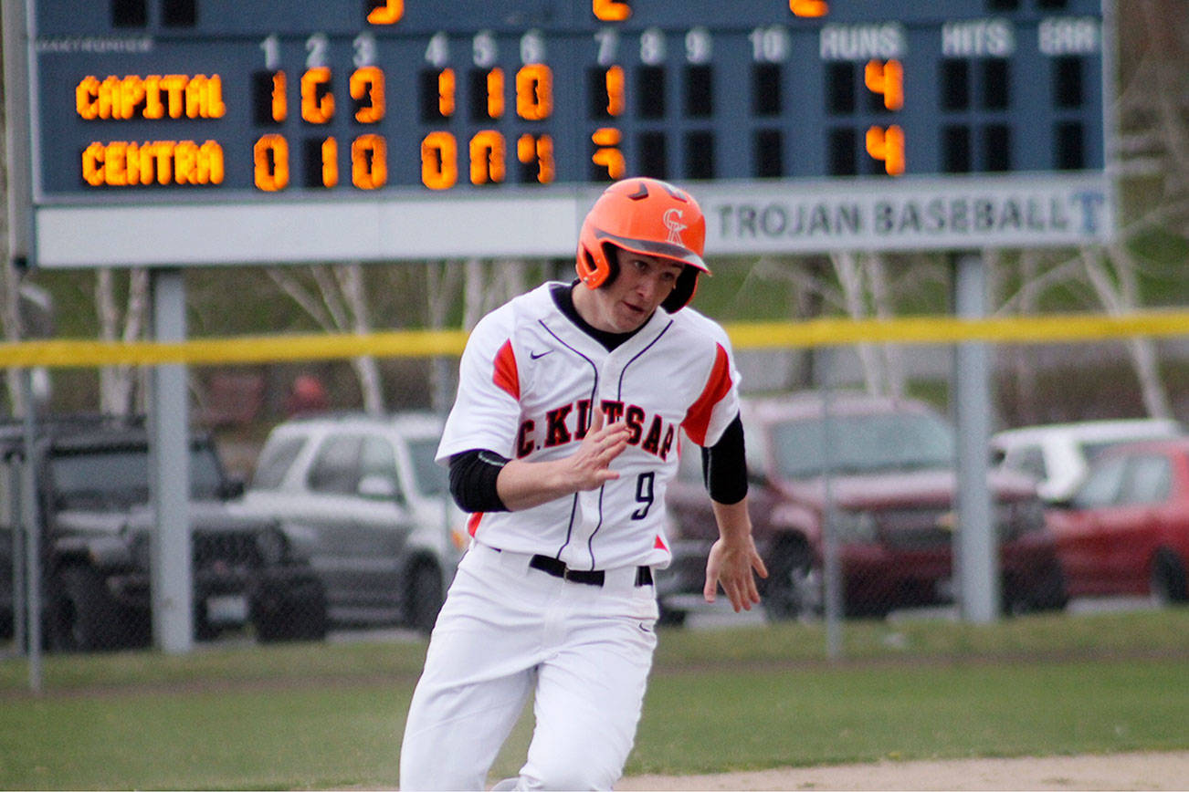 Junior Kaden McDowell, who entered the game as a pinch runner, races for home plate. He scored the winning run for Central Kitsap to complete his team’s comeback bid. Jacob Moore | Kitsap Daily News