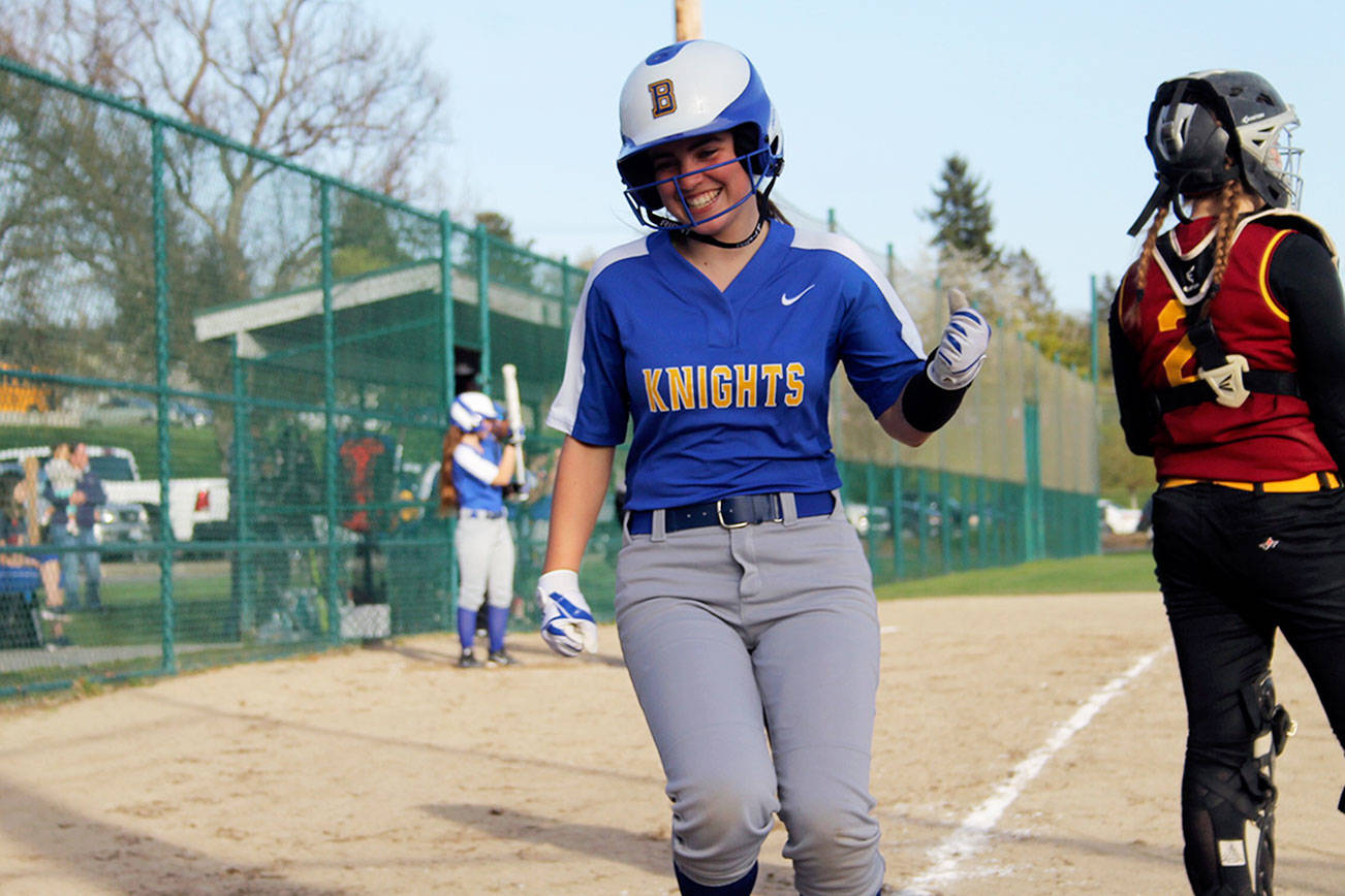 Bremerton infielder Karli Uhrich clenches her fist in celebration of her team taking a late 10-8 lead as she steps on home plate in the bottom of the sixth inning. Jacob Moore | Kitsap Daily News