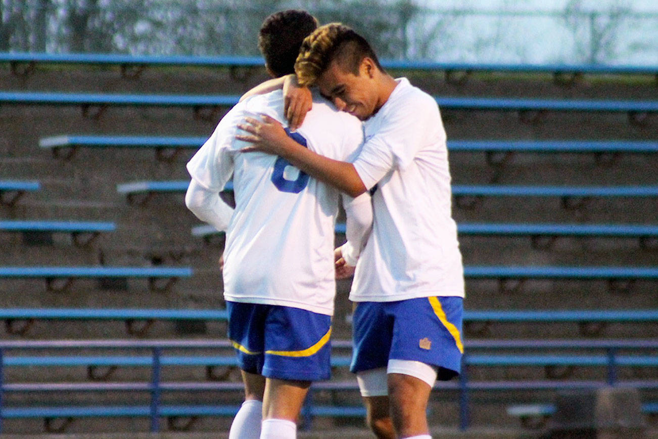 Bremerton senior James Moran, right, hugs his teammate, junior Luis Clemen, after he scored the second goal of the night. Jacob Moore | Kitsap Daily News