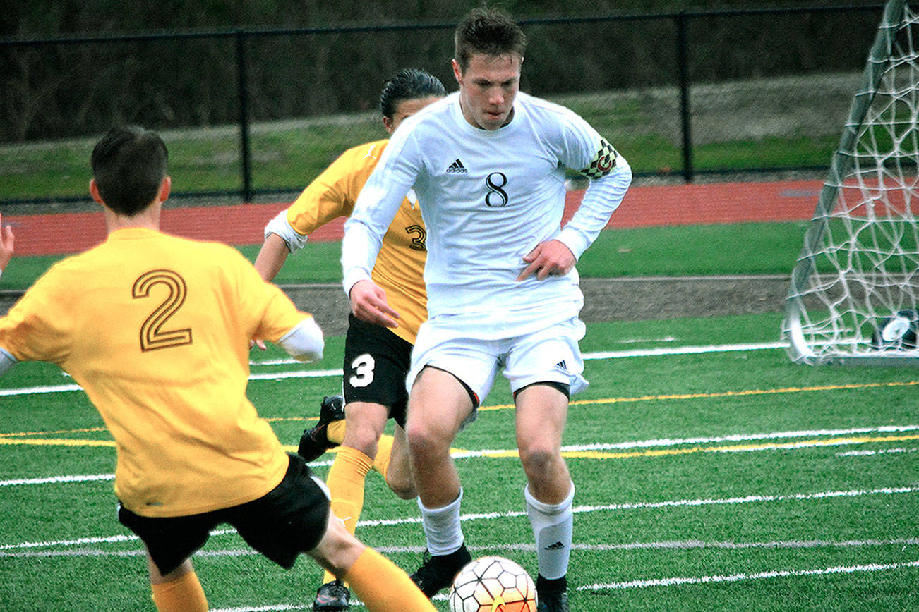 Klahowya junior Andrew Dickson looks down the field to start the counter attack in a 3-1 victory over Sequim on April 13. (Mark Krulish/Kitsap News Group)