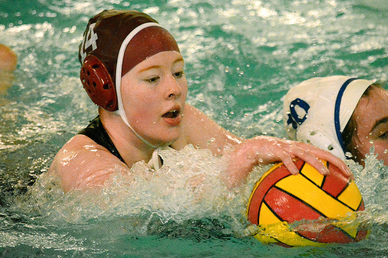 Jazmin Lamoureux fights for a loose ball during a water polo match against Tahoma on April 16. (Mark Krulish/Kitsap News Group)