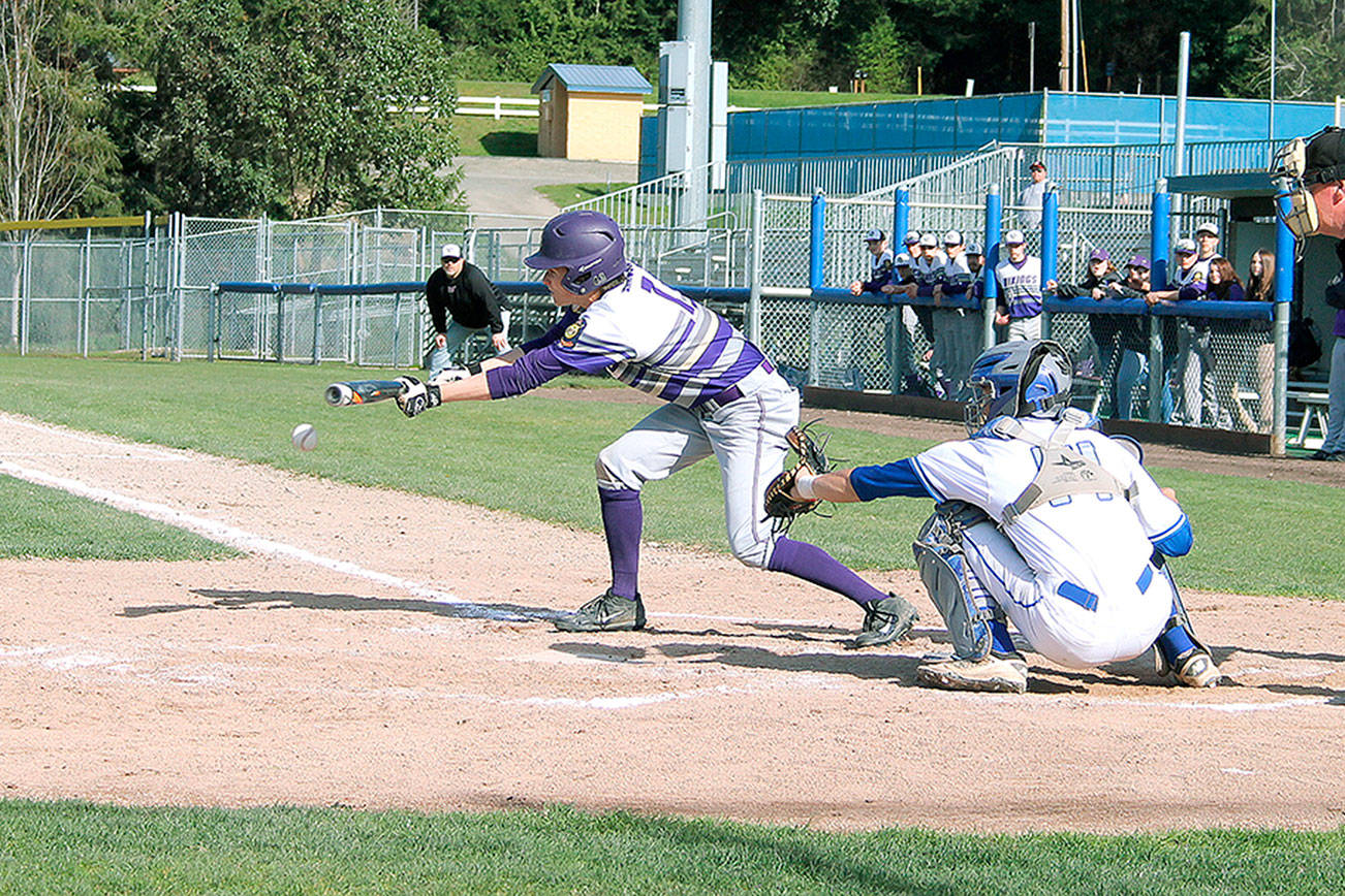 North Kitsap second baseman Max Larsen lays down a bunt during his team’s 13-1 victory on April 18. (Mark Krulish/Kitsap News Group)