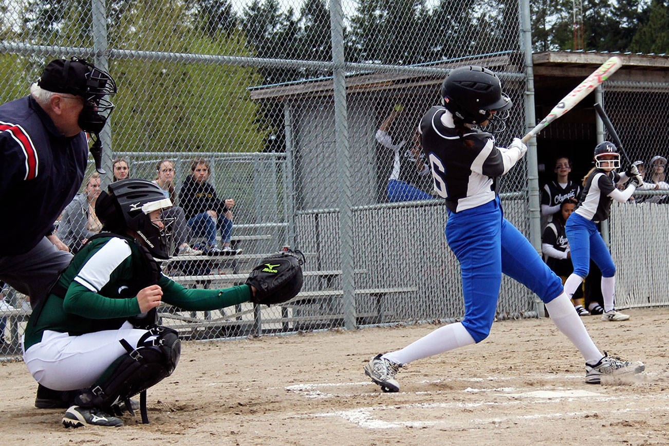 Olympic senior Ashlyn Morris grounds the ball toward third base in the first inning of the April 20 game against Port Angeles. Jacob Moore | Kitsap Daily News