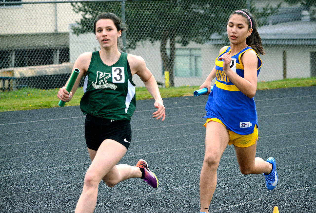 Klahowya’s Madison Godsey (left) and Bremerton’s Angelina Wojciechowski race during the sprint medley relay (Mark Krulish/Kitsap News Group)