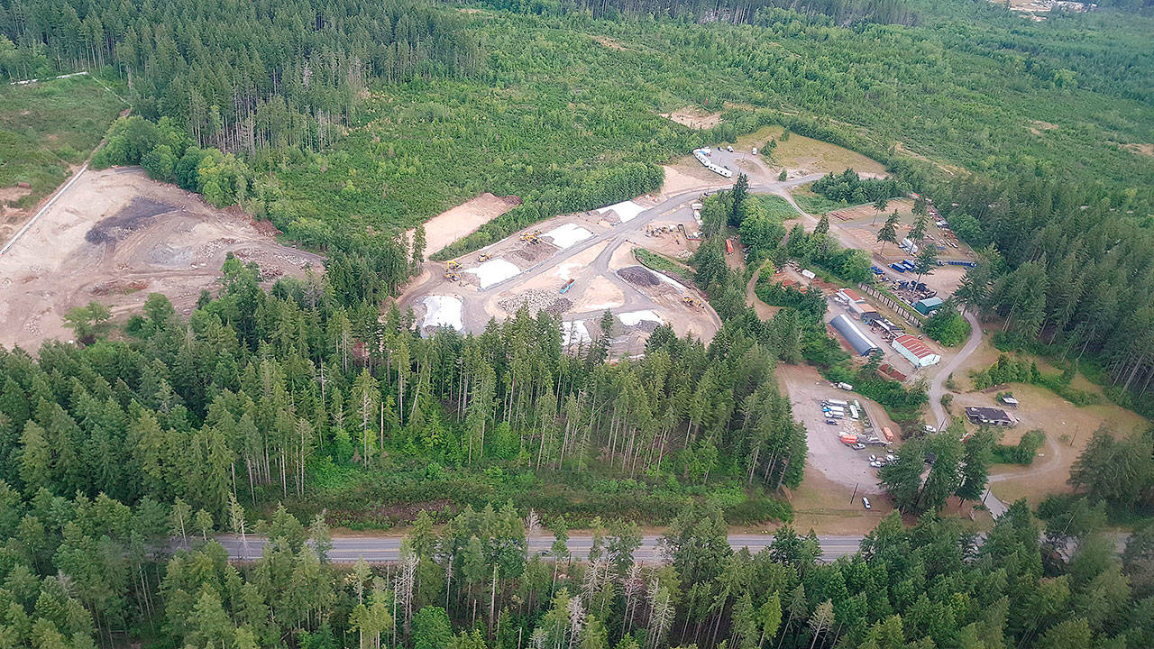 An aerial photo shows the landfill site at left and stockpile area in the center. Office trailers onsite during the cleanup are in the upper right of the photo. (Environmental Protection Agency photo 2017)