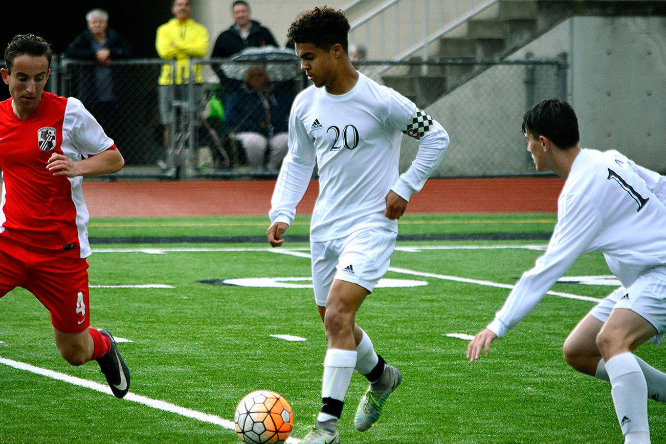 Darius Joe attempts to dribble through the Coupeville defense during a 3-0 win on May 10. (Mark Krulish/Kitsap News Group)