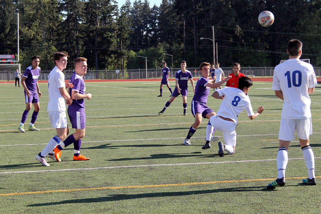 Senior Nate Blanchard lets out a kick in the first half that allowed the ball to reach the back of the net, tying the game at 1-1. Jacob Moore | Kitsap Daily News
