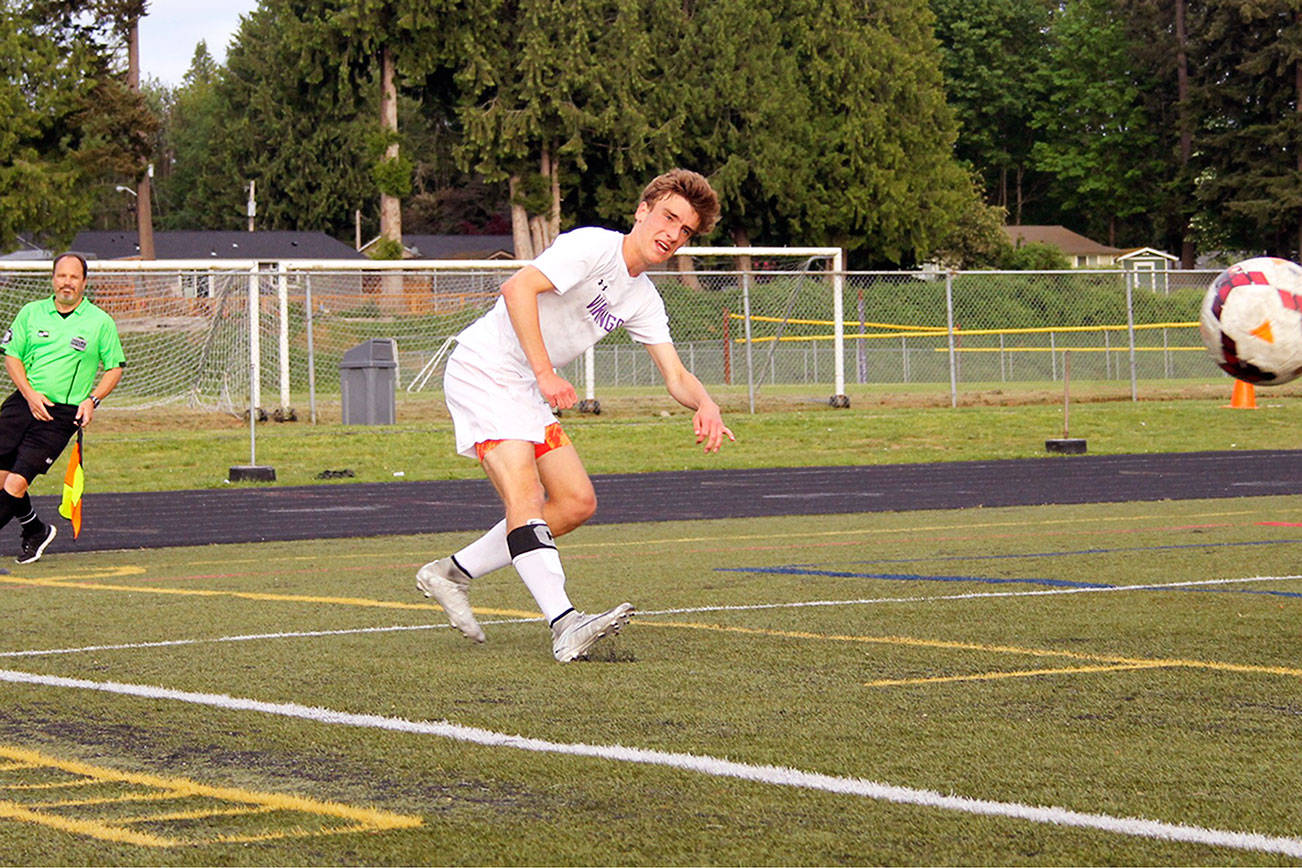 NK senior Nate Blanchard unleashes a kick toward goal in the first half of the game against Archbishop Murphy on May 16. Jacob Moore | Kitsap Daily News