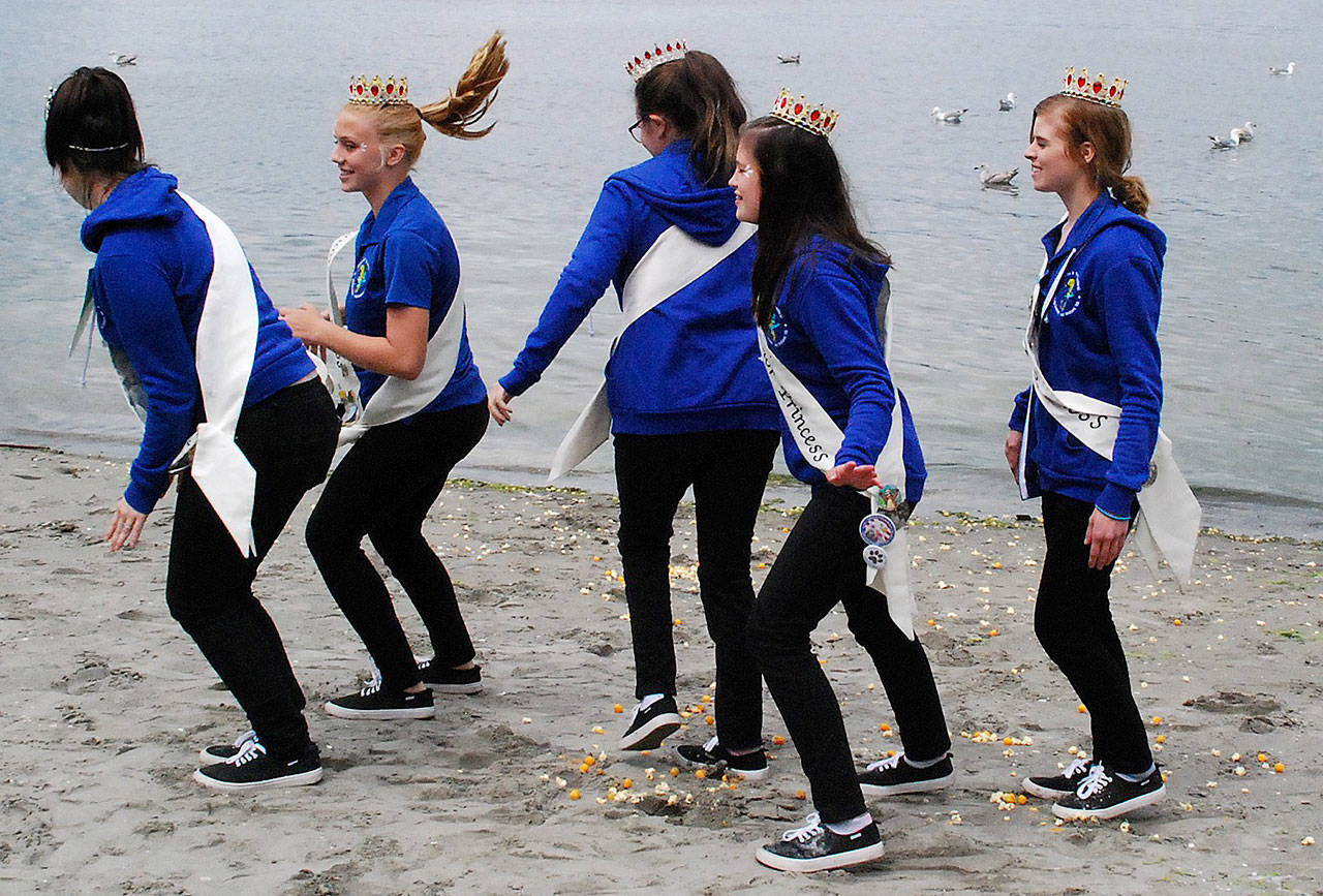 Junior Princess Danyelle Wilcox (second from left) takes a hair-flipping hop with members of the Fathoms O’ Fun Royalty Court at the Seagull Calling Contest May 26. (Bob Smith | Kitsap Daily News photo)