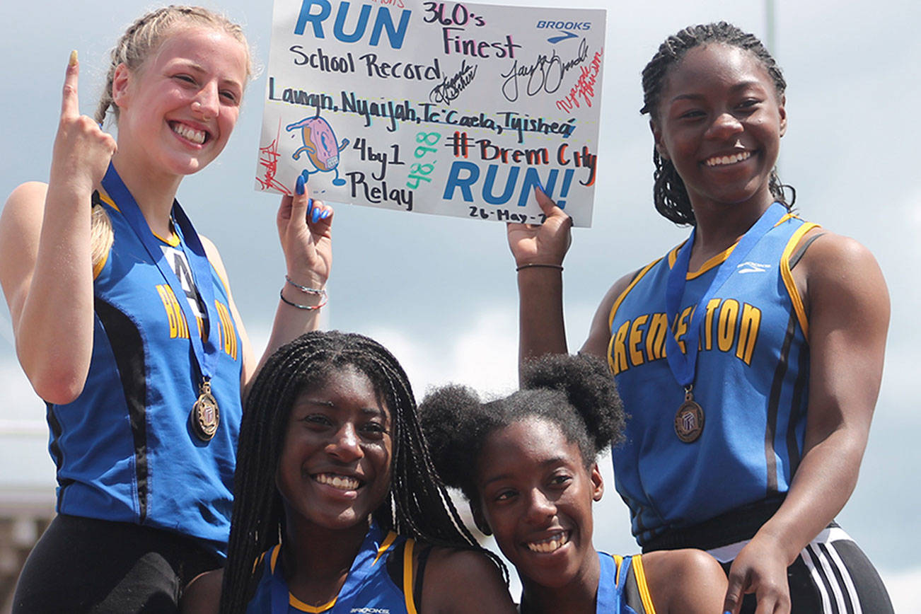 Bremerton’s 4x100 relay team of Lauryn Chandler (top left), Nyaijah Johnson (bottom left), Tyishea McWhorter (bottom right) and Te’Caela Wilcher (top right) captured a state championship at the WIAA 2A state meet. (Mark Krulish/Kitsap News Group)