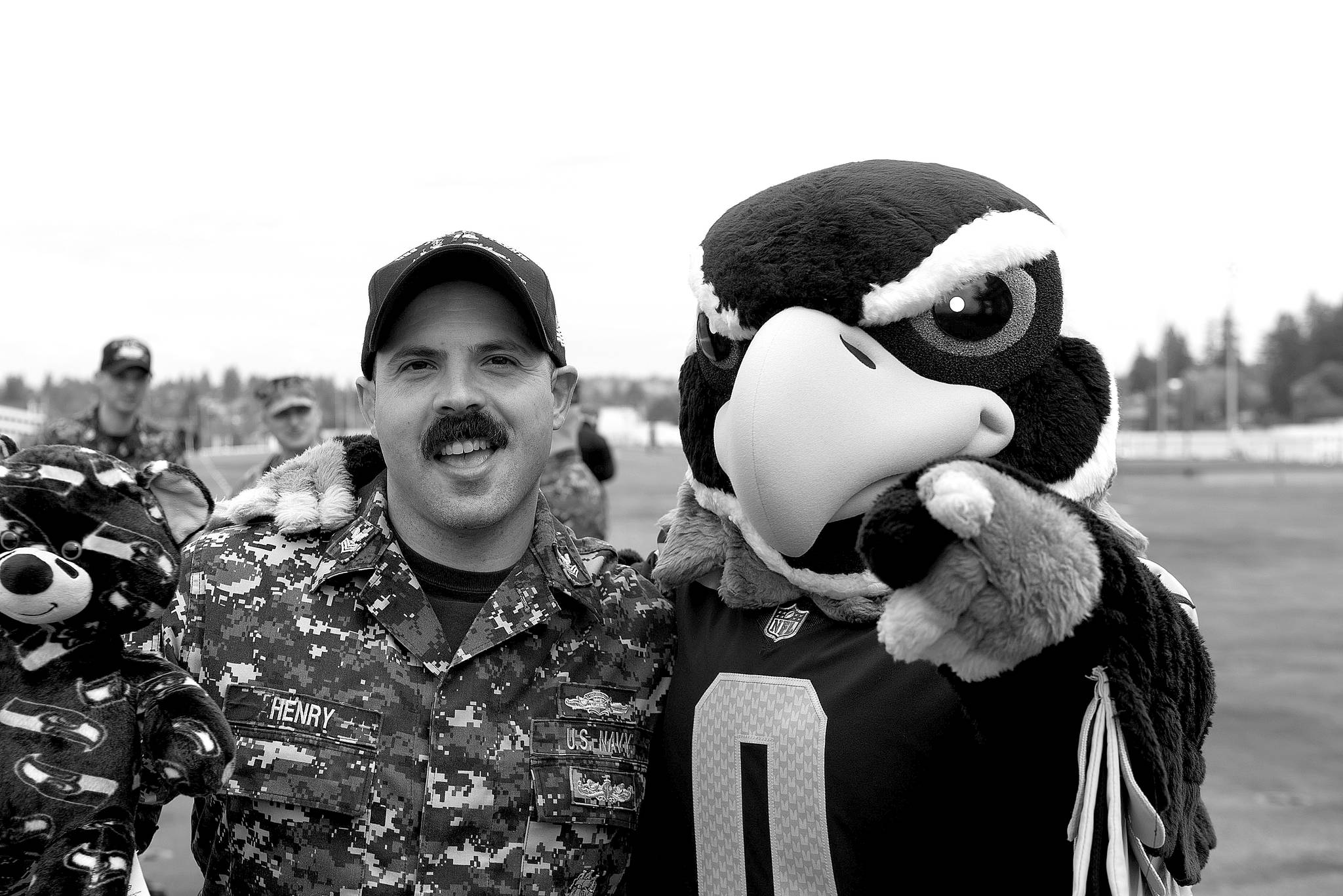 Electrician’s Mate 1st Class Joshua Henry, from Gilchrist, Oregon, poses with Seattle Seahawks mascot, Blitz, aboard the aircraft carrier USS John C. Stennis (CVN 74). The Seattle Seahawks football team and Sea Gals cheerleaders held a military appreciation event aboard to meet and talk with Sailors. John C. Stennis is pier-side after returning to homeport after the completion of a seven-week underway where the ship’s crew completed TSTA/FEP early and Carrier Strike Group 3 Group Sail in preparation for its next scheduled deployment.                                Mass Communications Specialist Seaman Angelina Grimsley / U.S. Navy