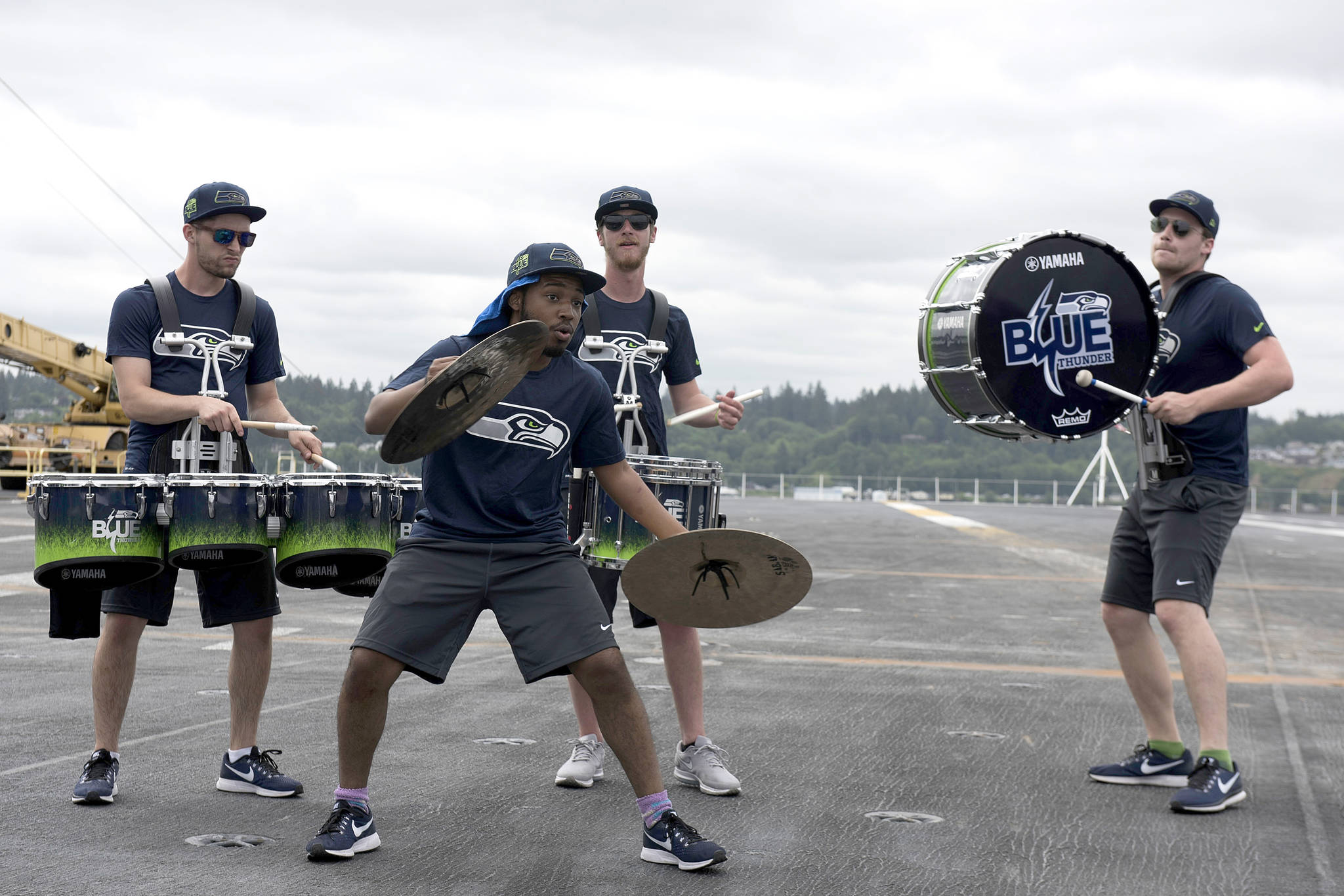 The Seattle Seahawks drumline, Blue Thunder, performs aboard the aircraft carrier USS John C. Stennis (CVN 74). The Seattle Seahawks football team and Sea Gals cheerleaders held a military appreciation event aboard to meet and talk with sailors.                                Mass Communications Specialist Seaman Angelina Grimsley / U.S. Navy