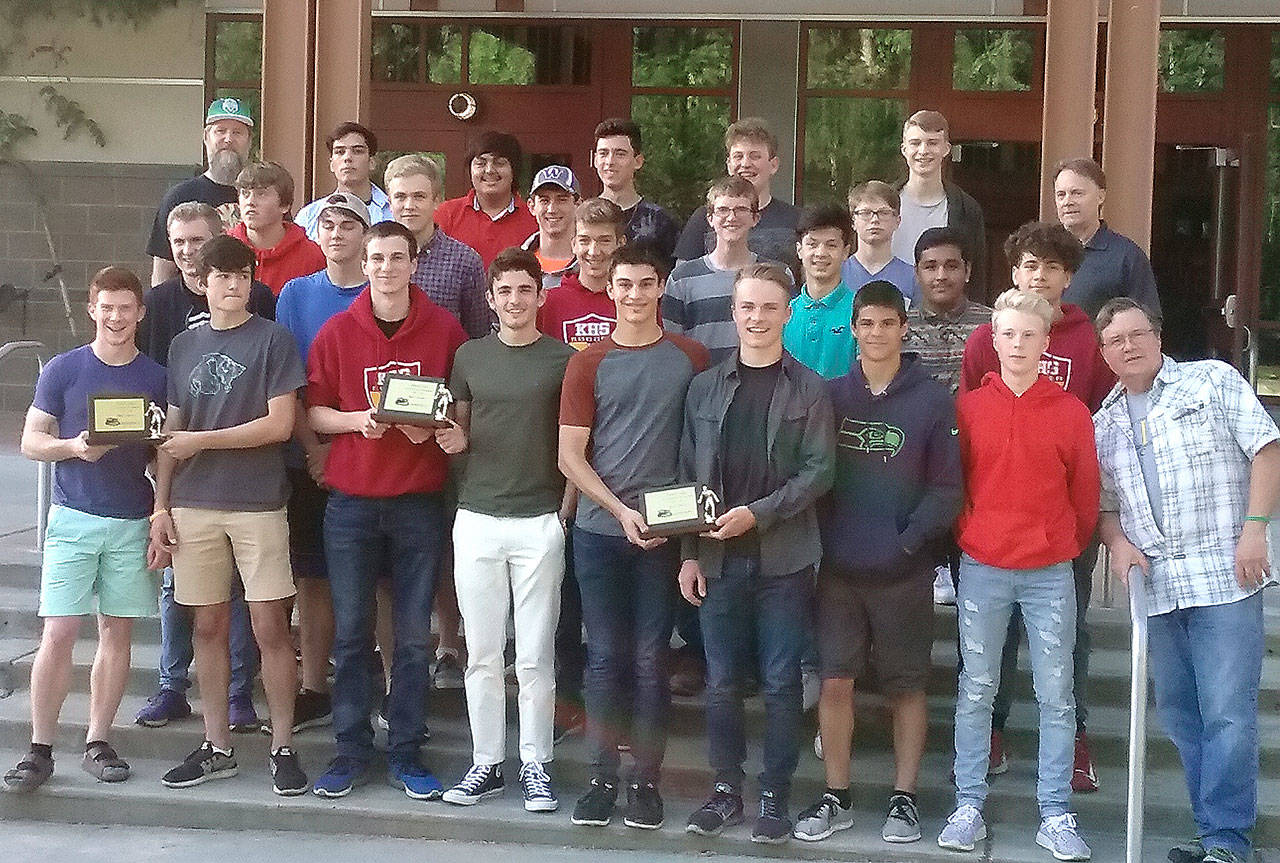 The Kingston boys soccer team holds the league championships trophies earned by the senior class during their time. The Bucs have won the past three in a row. (Mark Krulish/Kitsap News Group)