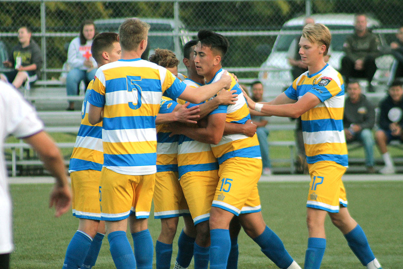 The Pumas celebrate after Ismael DeLuna (15) scored his second goal of the game. DeLuna is a former North Kitsap standout. (Mark Krulish/Kitsap News Group)