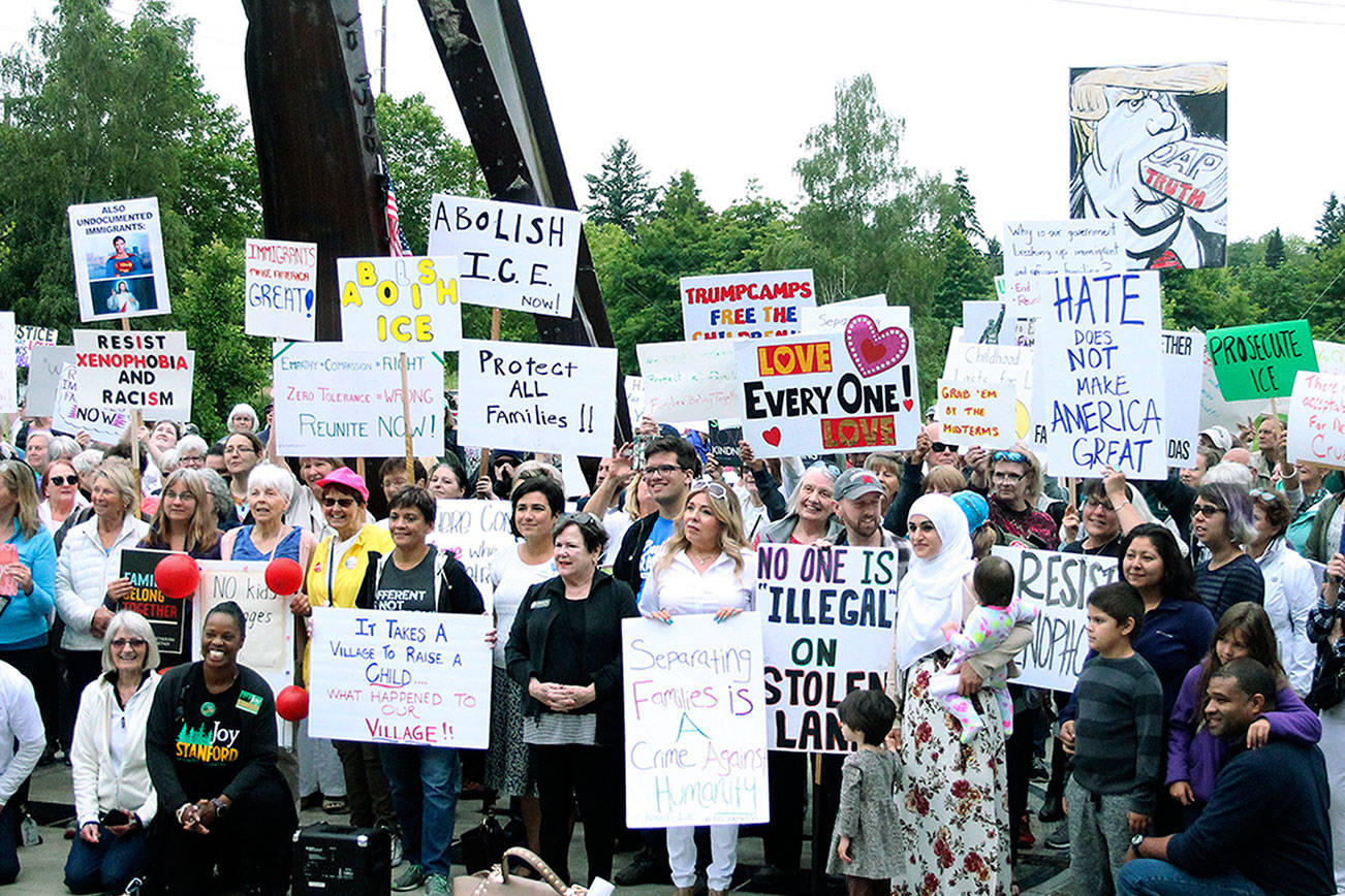 Hundreds gather in Bremerton’s Evergreen Park to protest family separations