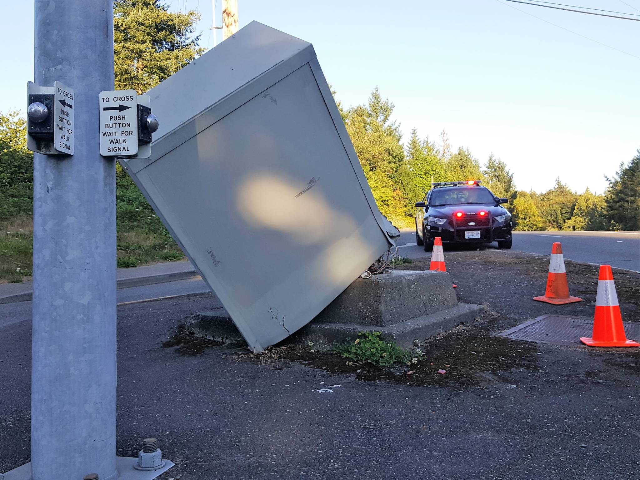 A traffic control box at the intersection of Sidney and Tremont streets in Port Orchard was collateral damage from a vehicle collision that plowed into the signal stanchion Saturday evening, Aug. 4. The pole wasn’t damaged but the light signal box was knocked off its base. (Robert Zollna | Kitsap Daily News)
