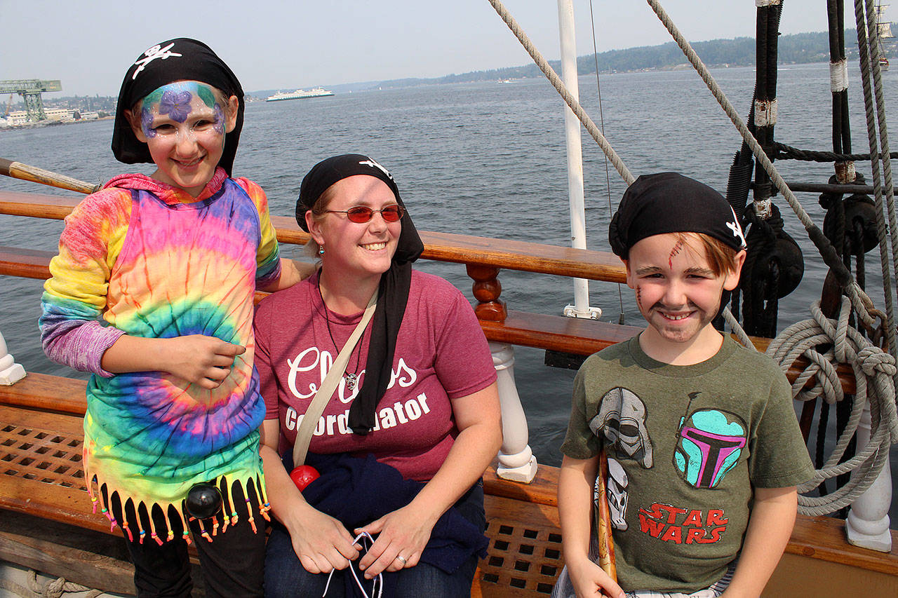 Sabrina Blair, 9, and Matthew Blair, 6, don pirate wear for their voyage on Hawaiian Chieftain. Mom is in the middle. (Bob Smith | Kitsap Daily News)