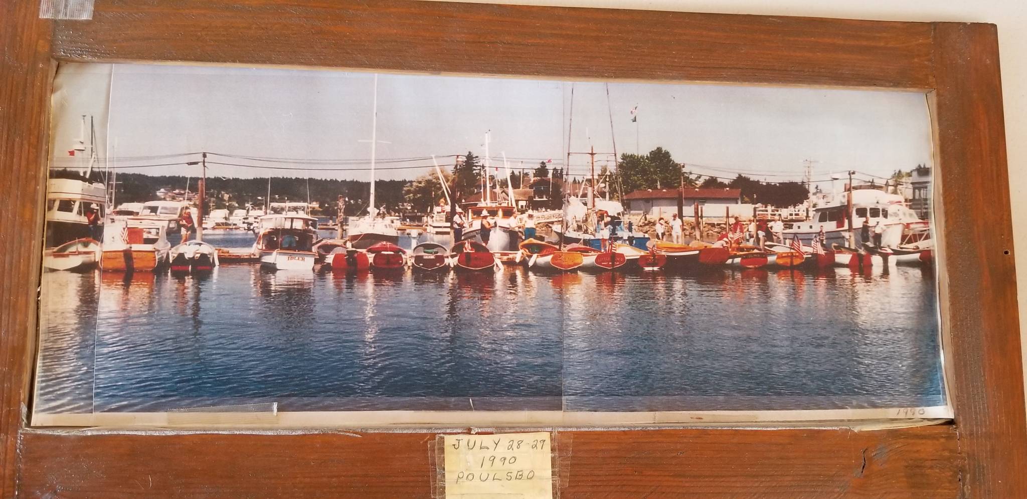 A photo from the 1990 of the Poulsbo Boat Rendezvous sees a number of Young’s characteristic boat moored at the Port of Poulsbo.