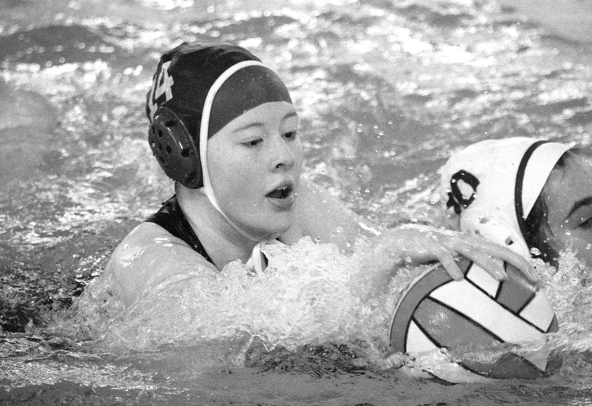 Mark Krulish | Kitsap News Group                                Jazmin Lamoureux fights for a loose ball during a water polo match against Tahoma in April.