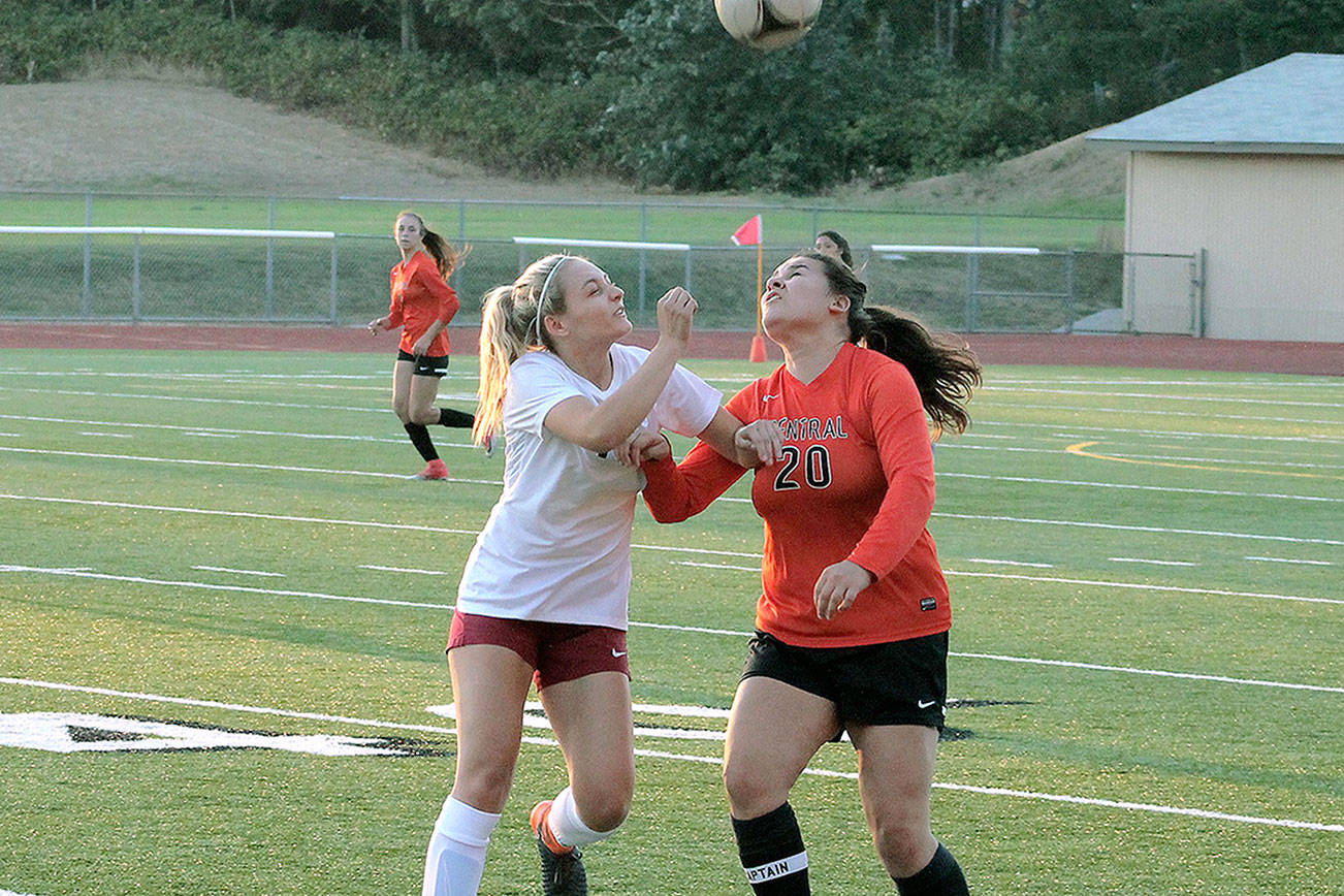 South Kitsap’s Eliza Villarma and Central Kitsap’s Camryn Castro battle for possession of the ball. (Mark Krulish/Kitsap News Group)