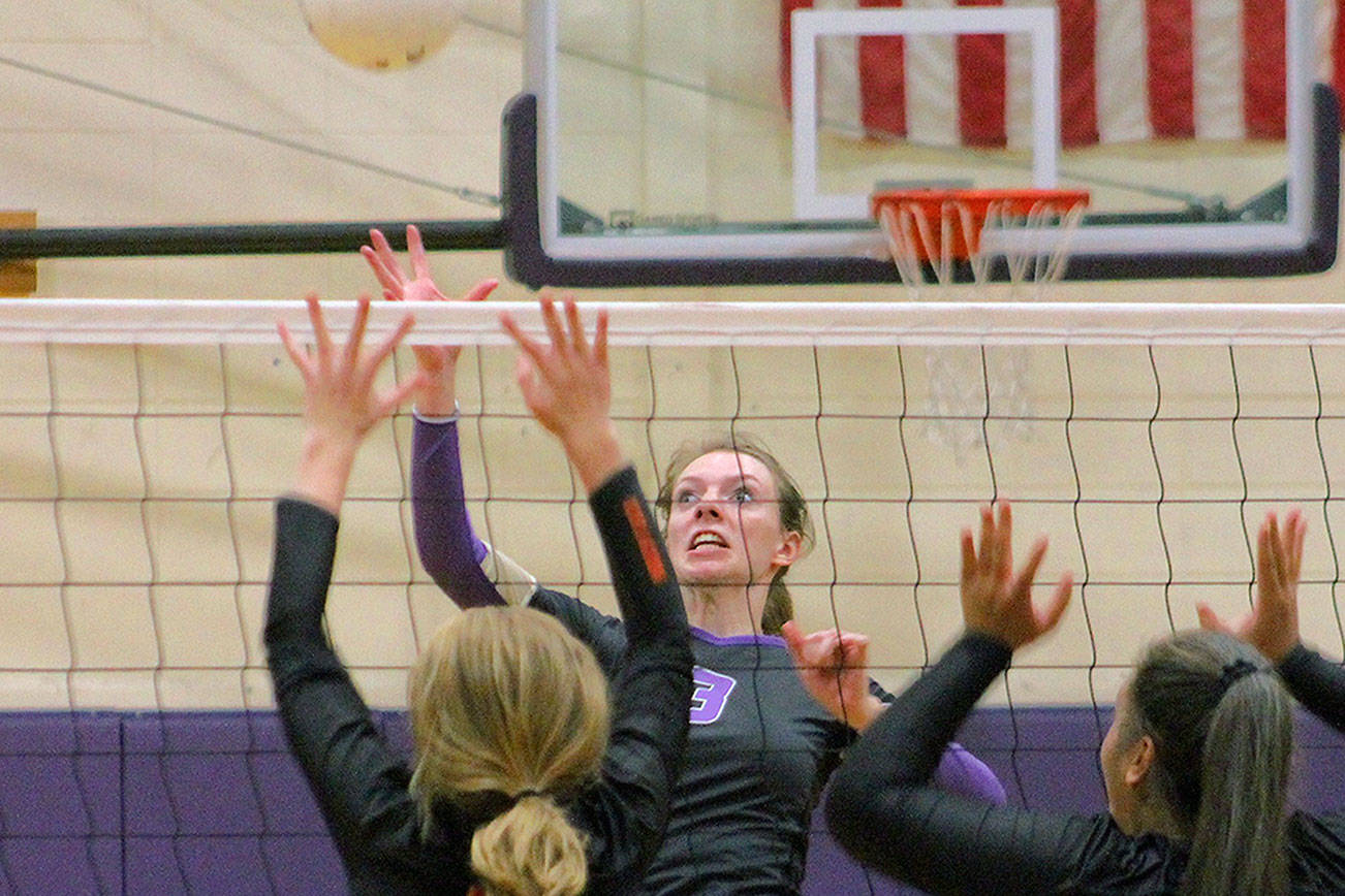 Middle blocker Taylyn Boop guards the net during North Kitsap’s five-set win over Steilacoom. (Mark Krulish/Kitsap Daily News)