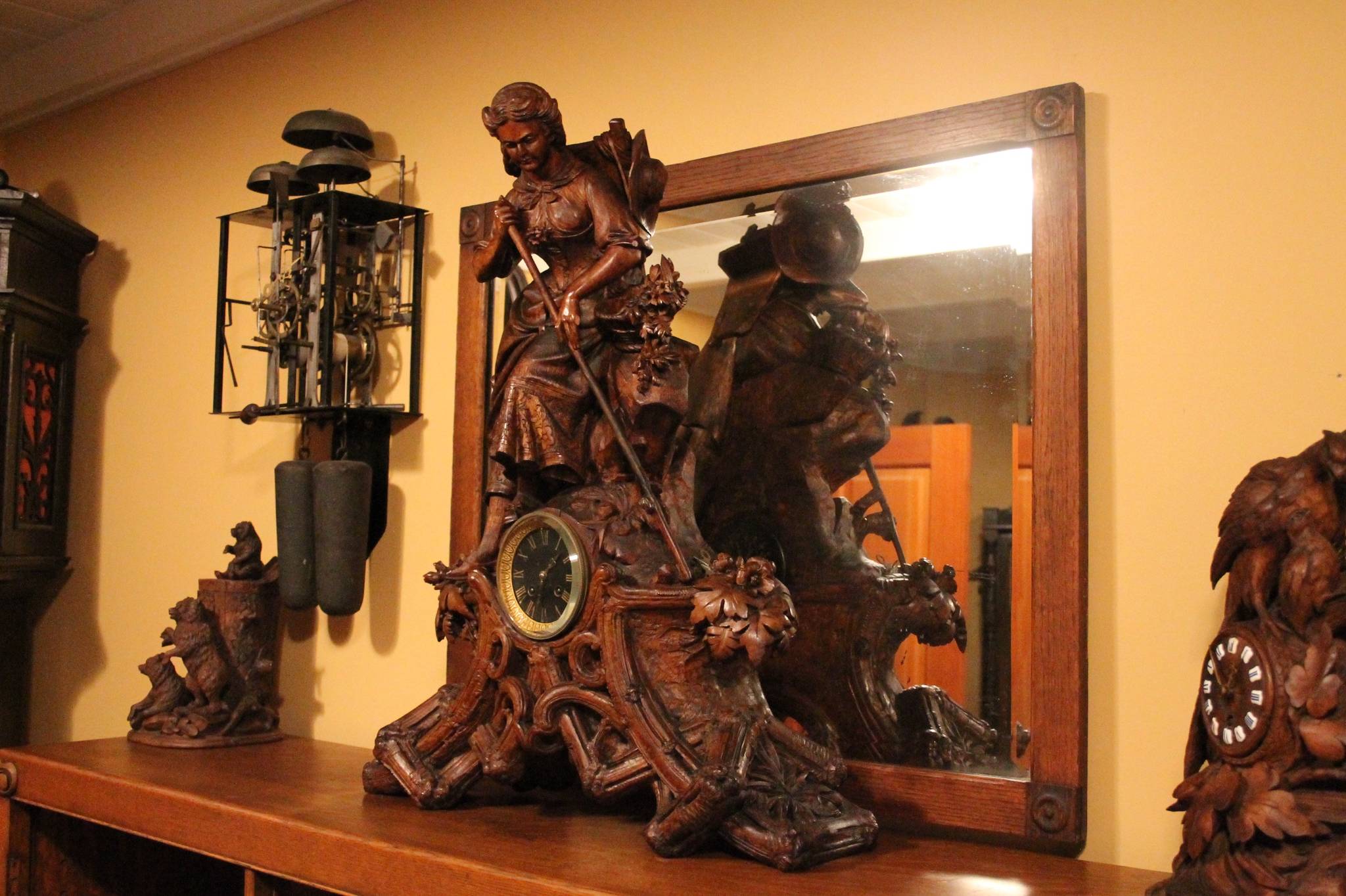 The clock at center features an intricate carving by Johann Huggler. Nick Twietmeyer | Kitsap News Group.
