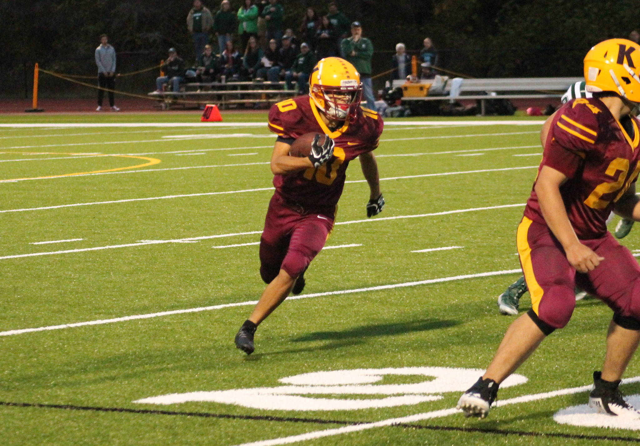 Kingston’s Kyler Coe-Yarr heads for the edge in a 28-6 loss to Port Angeles on Sept. 14. (Mark Krulish/Kitsap News Group)