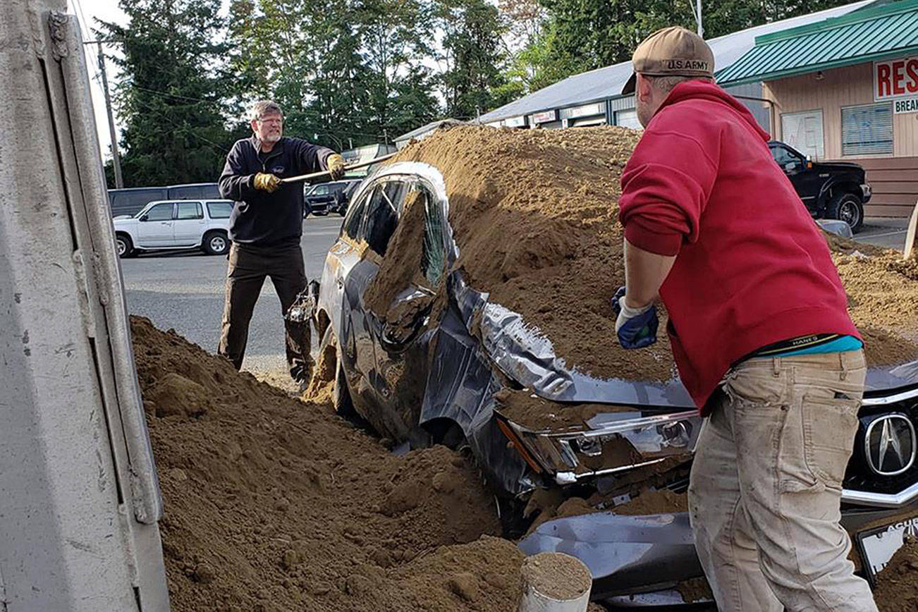Truck buries new Acura in dirt
