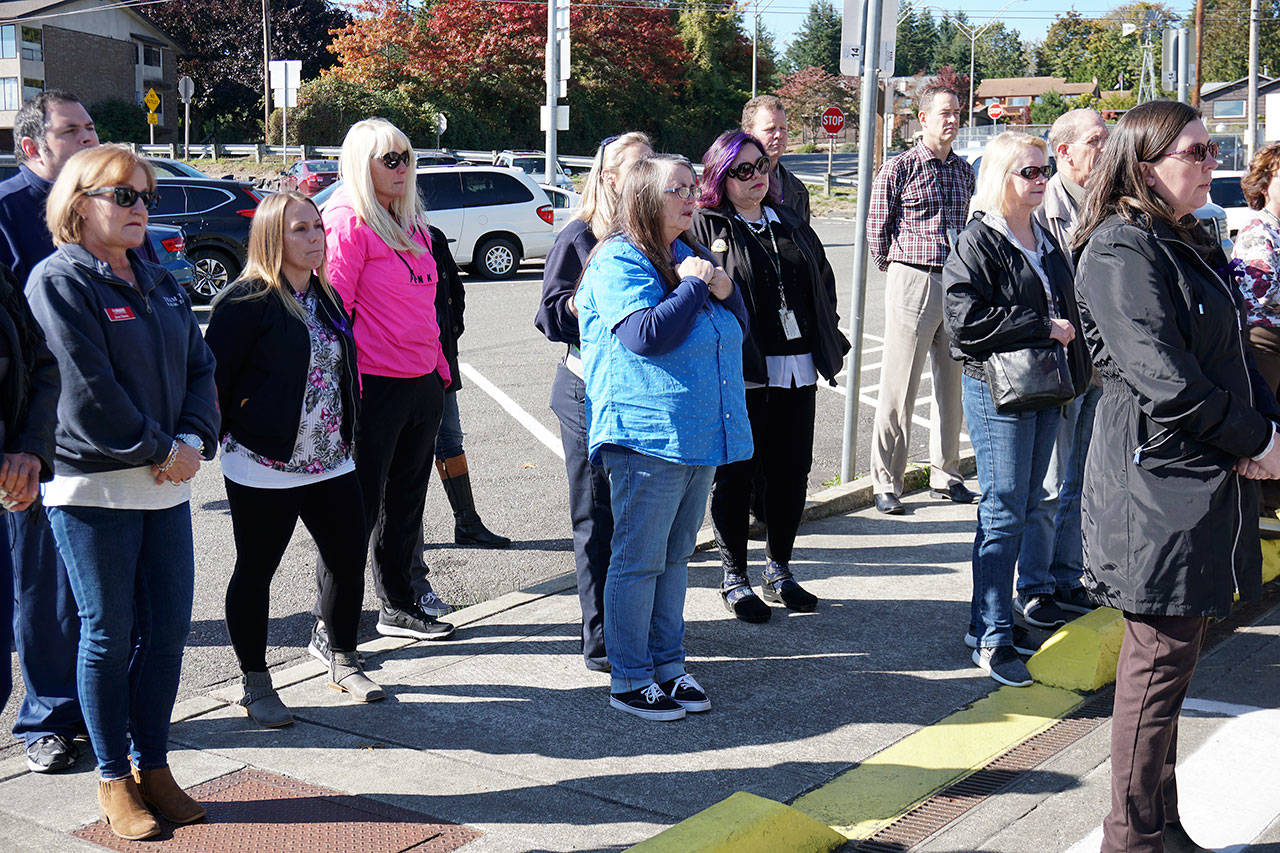Family members, friends, Washington State Ferries employees and customers listen as Southworth Terminal Supervisor Phil Olwell shares his memories of late employee Katie Phillips. (Bob Smith | Kitsap Daily News)