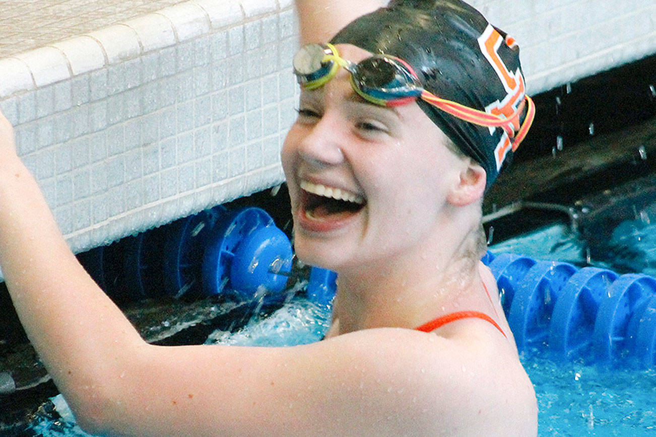 Central Kitsap’s Haley Morkert celebrates her victory in the 50-yard freestyle event. (Mark Krulish/Kitsap News Group)