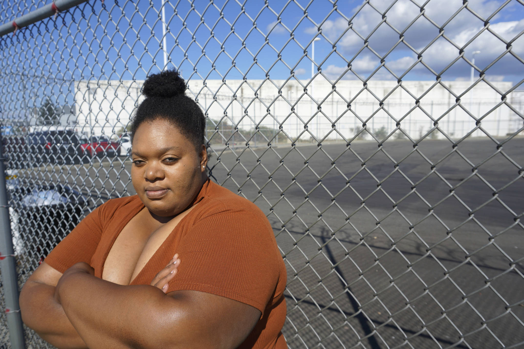 ShaCorrie Tunkara stands outside of the detention center where her husband has been detained since January. Photo by Melissa Hellmann
