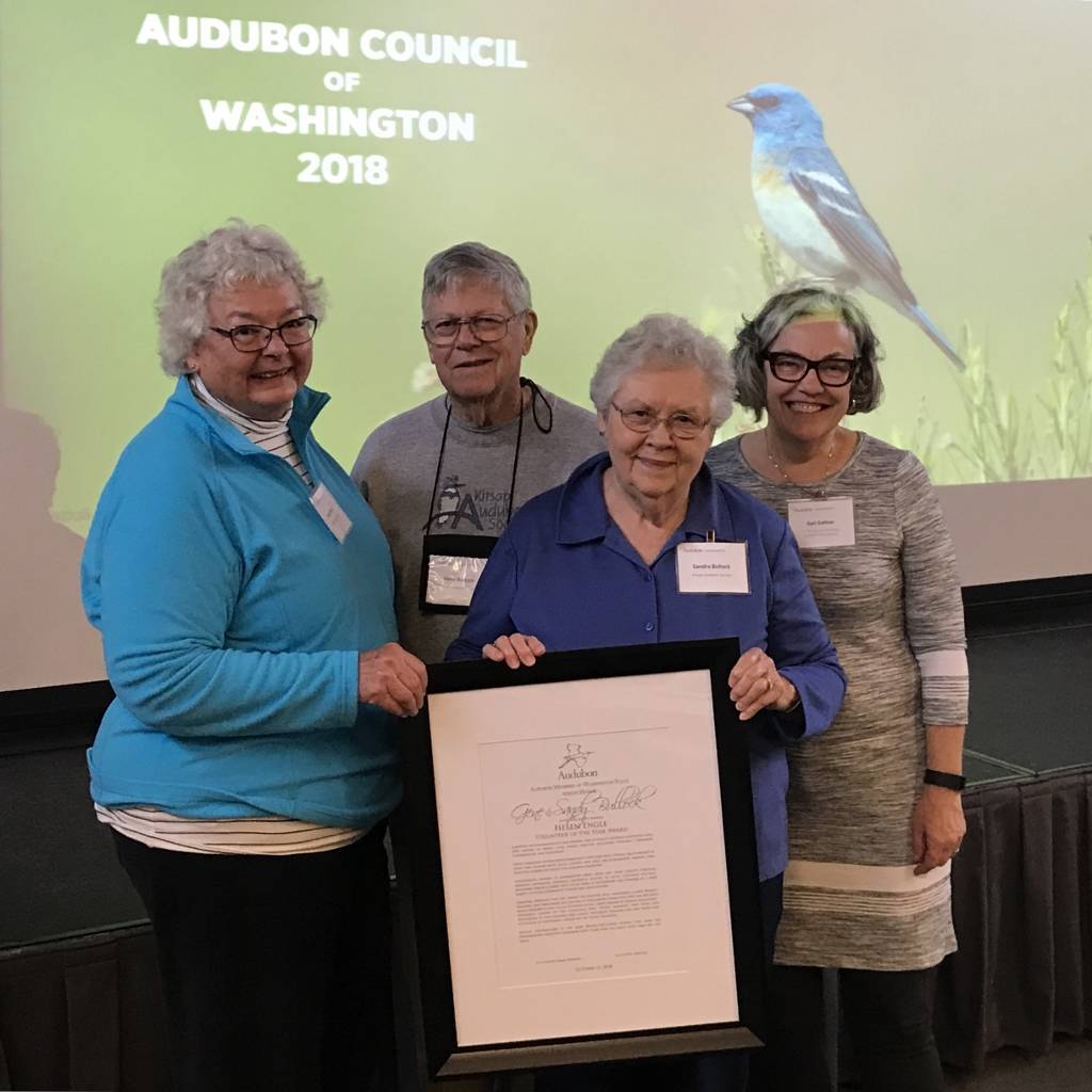 Judy Willott of Bainbridge Island, left, presents Helen Engle Award to Gene and Sandy Bullock, assisted by Gail Gatton, far right, executive director of Washington State Audubon. (Photo by Don Willott)