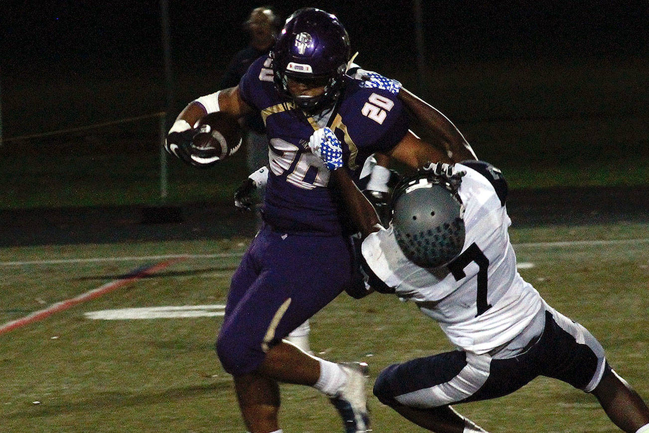 Isaiah Kahana breaks free for a 32-yard run in the first half against River Ridge. (Mark Krulish/Kitsap News Group)