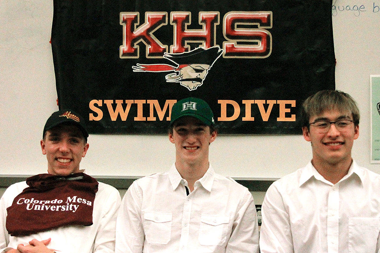 Kingston seniors Ethan Fox, Tim Gallagher and Aron Markow have signed their letters of intent to swim at Colorado Mesa University, University of Hawaii and University of Wyoming respectively. (Mark Krulish/Kitsap News Group)