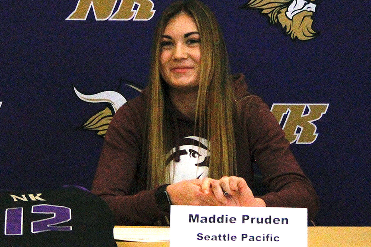 Maddie Pruden signs her letter of intent on Nov. 14 at North Kitsap High School. (Mark Krulish/Kitsap News Group)