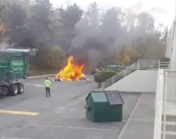 VIDEO | Trash fire burns behind strip mall on Silverdale Way