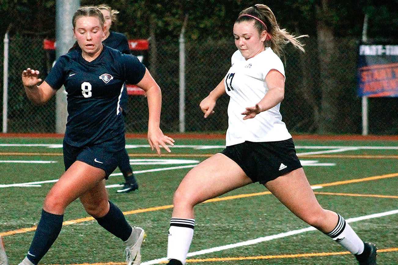 Kayden Eckley tries to slip by the Knights defense during her team’s 1A state semifinal game. (Mark Krulish/Kitsap News Group)