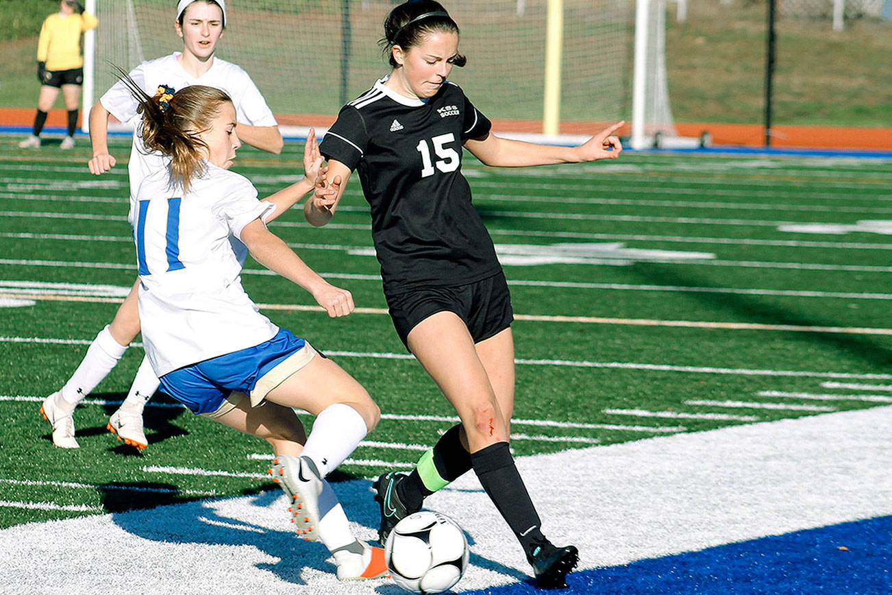 Kate Streck (15) battles for the ball with Deer Park’s Carmen Kiewert during the 1A state tournament third place game. (Mark Krulish/Kitsap News Group)