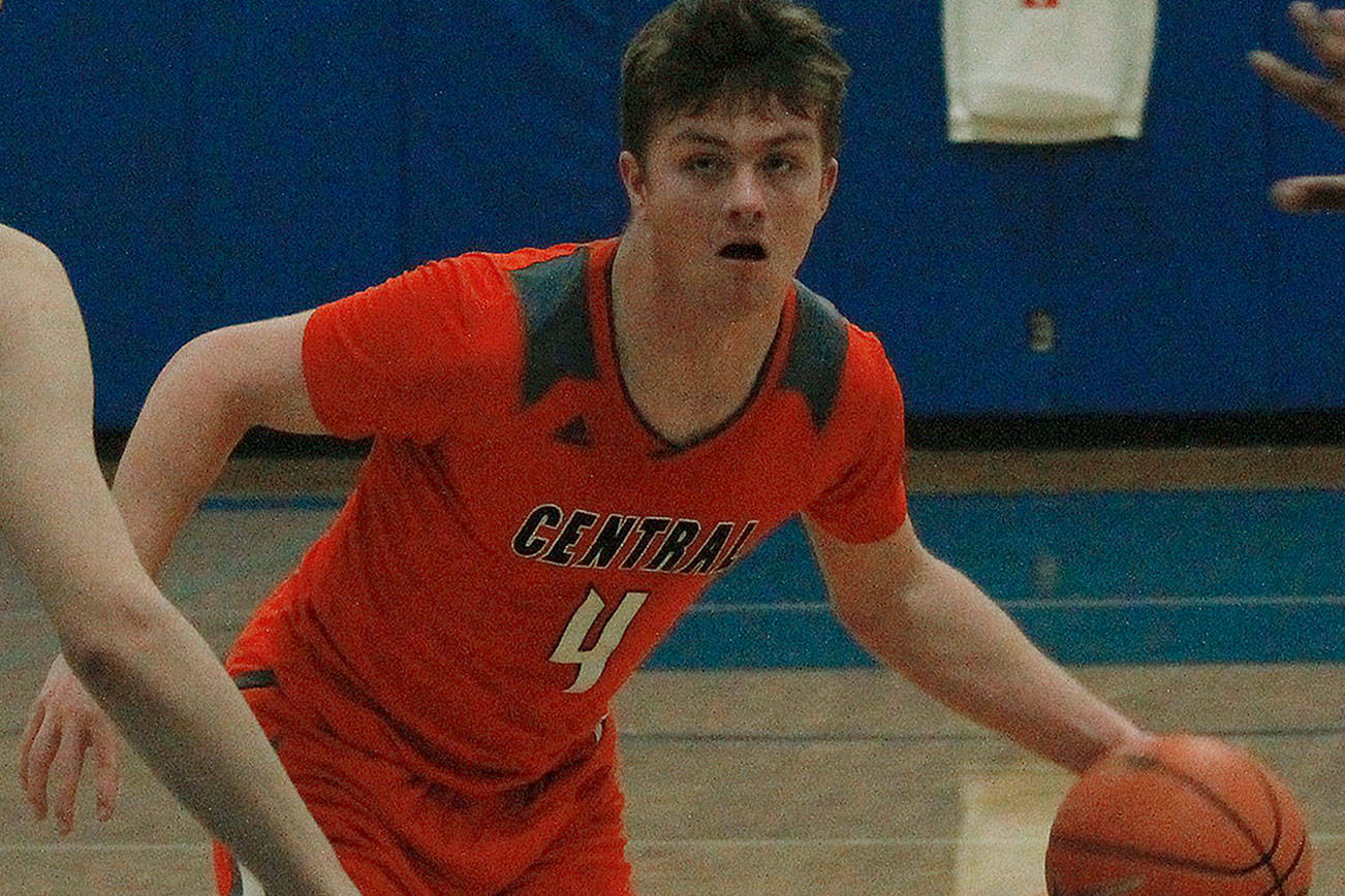 Central Kitsap guard Austin McMinds helped the Cougars get off to a hot start against Olympic. He finished the game with 15 points. (Mark Krulish/Kitsap News Group)