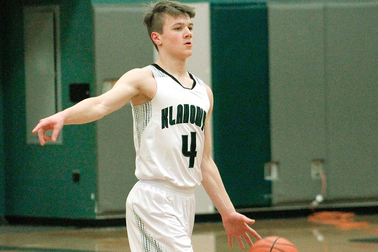 Klahowya guard Gabriel Smith sets up the offense during his team’s league victory over Chimacum. (Mark Krulish/Kitsap News Group)