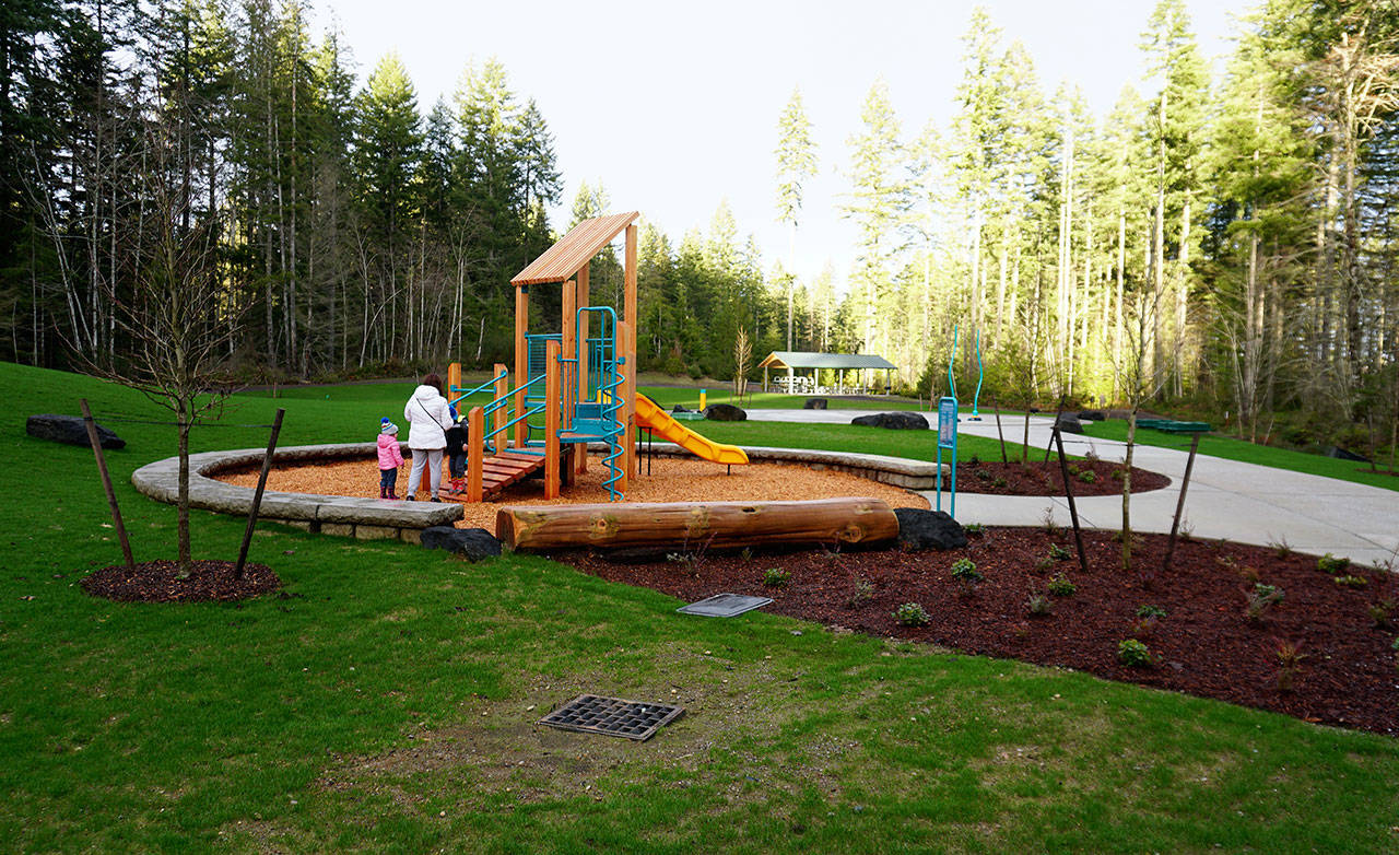 Some residents got a quick preview of the new McCormick Village Park prior to its official ribbon-cutting ceremony Dec. 21. (Bob Smith | Kitsap Daily News)