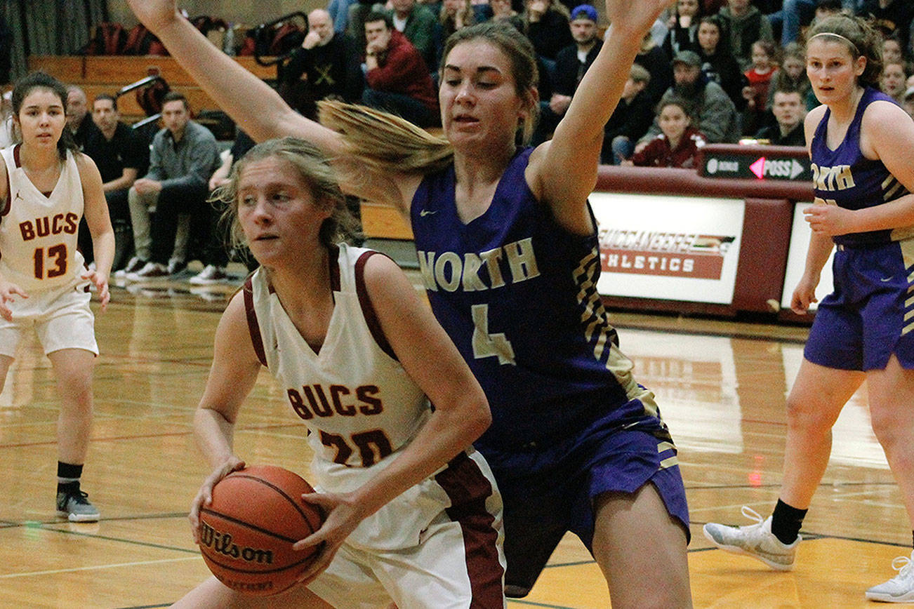 North Kitsap’s Maddie Pruden (4) guards the paint against Kingston freshman Ellee Brockman (20) during the Vikings’ 51-40 victory.