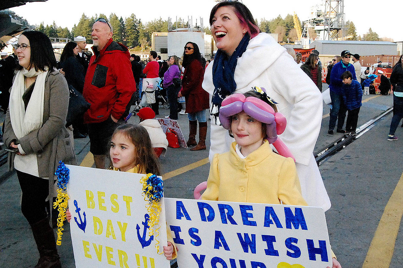 &lt;strong&gt;And a year ago … the Nimitz returns home (Dec. 15, 2017)&lt;/strong&gt;                                While the crew of the aircraft carrier USS Nimitz returned home to Naval Base Kitsap-Bremerton just in time for Christmas in December 2017, it’s worth a second look. The series of photos detailing the Nimitz homecoming won an award in the color photo essay competition in the Washington Newspaper Publishers Association journalism contest. As part of the essay, I followed newlywed Holly Carlson and her family as they anxiously waited for her husband Nicolai to disembark on the gangway.