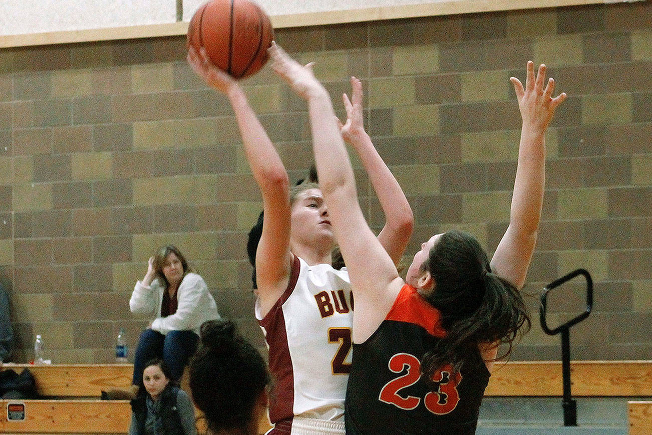 Kingston freshman Ellee Brockman tries to put a shot over Central Kitsap’s Alexandra Neumann. (Mark Krulish/Kitsap News Group)