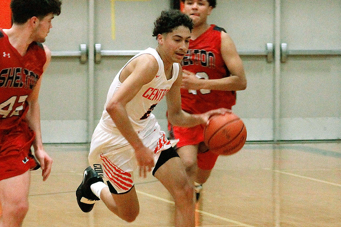 Central Kitsap guard Owen Davies run by the Shelton defense in his team’s Jan. 9 win. (Mark Krulish/Kitsap News Group)