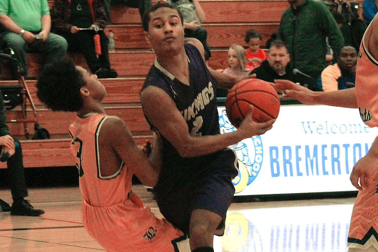 North Kitsap guard Kobe McMillian drives the lane in his team’s 62-34 win over Bremerton. (Mark Krulish/Kitsap News Group)