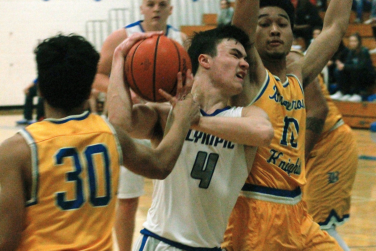 &lt;em&gt;Brandon Barron (4) attempts to slice between two Bremerton defenders during a Jan. 15 matchup&lt;/em&gt; Mark Krulish/Kitsap News Group