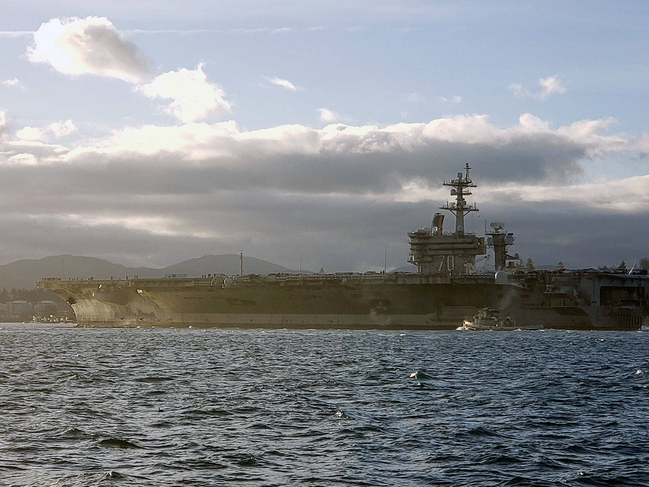 Aircraft carrier docks in Bremerton