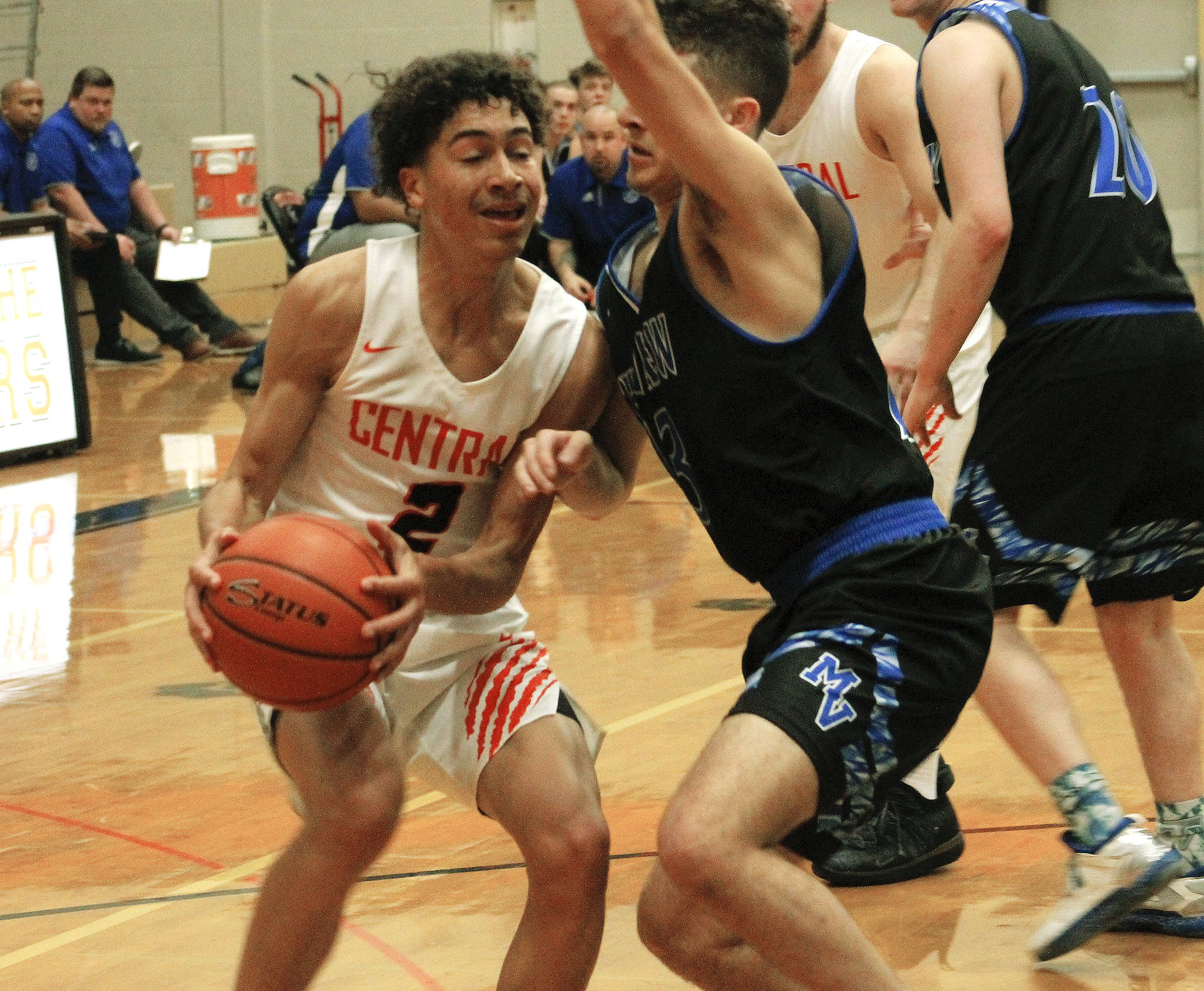 Owen Davies drives to the basket against Mountain View. The Cougars comeback effort fell short in an 80-77 loss. (Mark Krulish/Kitsap News Group)