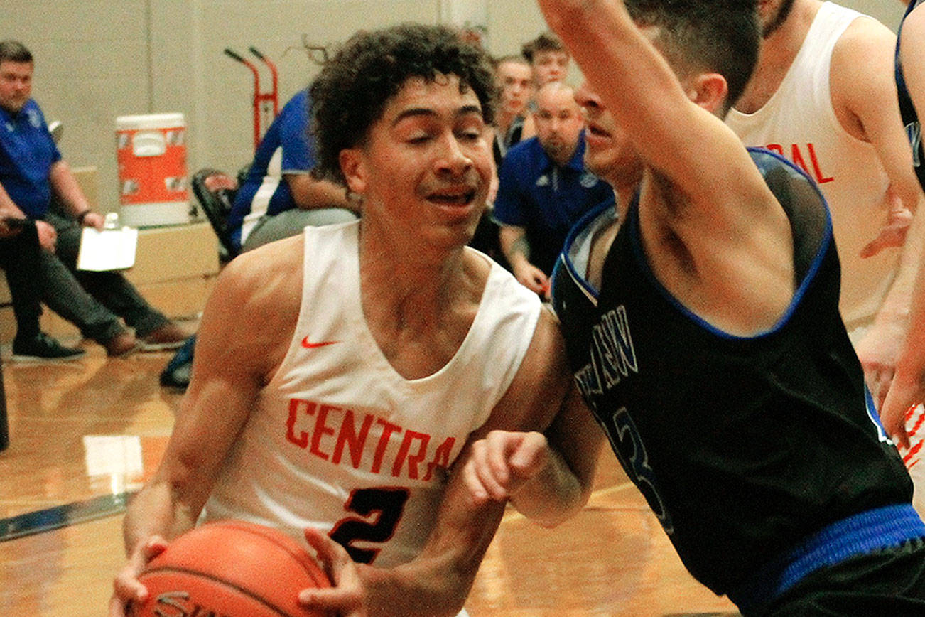 Owen Davies drives to the basket against Mountain View. The Cougars comeback effort fell short in an 80-77 loss. (Mark Krulish/Kitsap News Group)